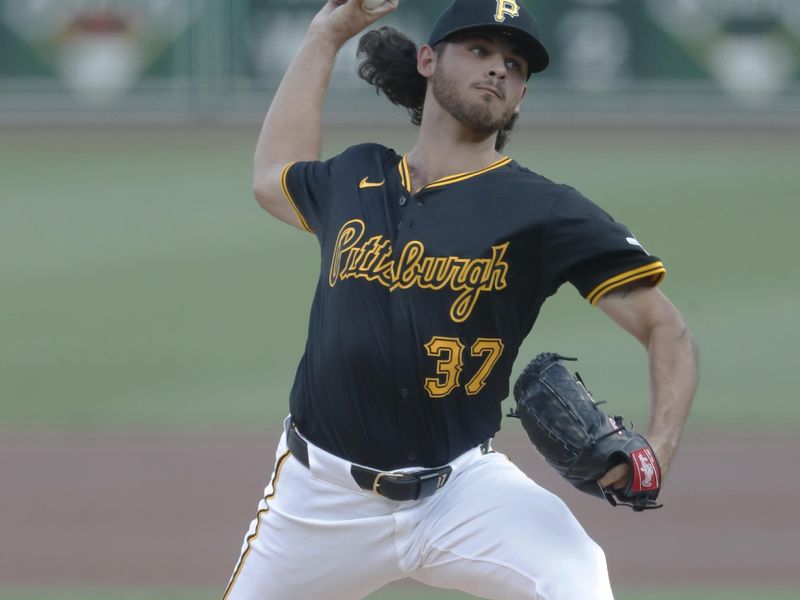 May 22, 2024; Pittsburgh, Pennsylvania, USA;  Pittsburgh Pirates starting pitcher Jared Jones (37) delivers a pitch against the San Francisco Giants during the first inning at PNC Park. Mandatory Credit: Charles LeClaire-USA TODAY Sports