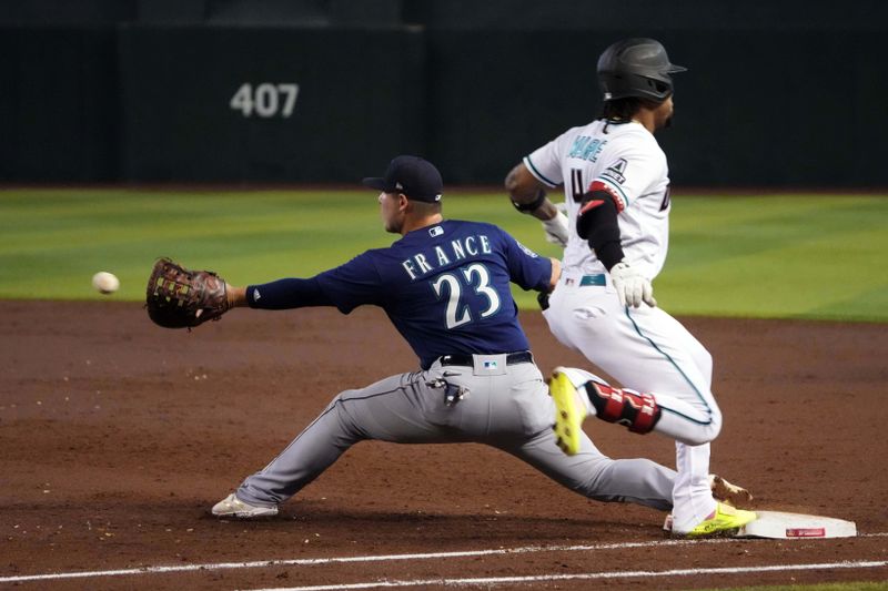 Jul 30, 2023; Phoenix, Arizona, USA; Arizona Diamondbacks designated hitter Ketel Marte (4) beats a throw to Seattle Mariners first baseman Ty France (23) for an infield single during the third inning at Chase Field. Mandatory Credit: Joe Camporeale-USA TODAY Sports