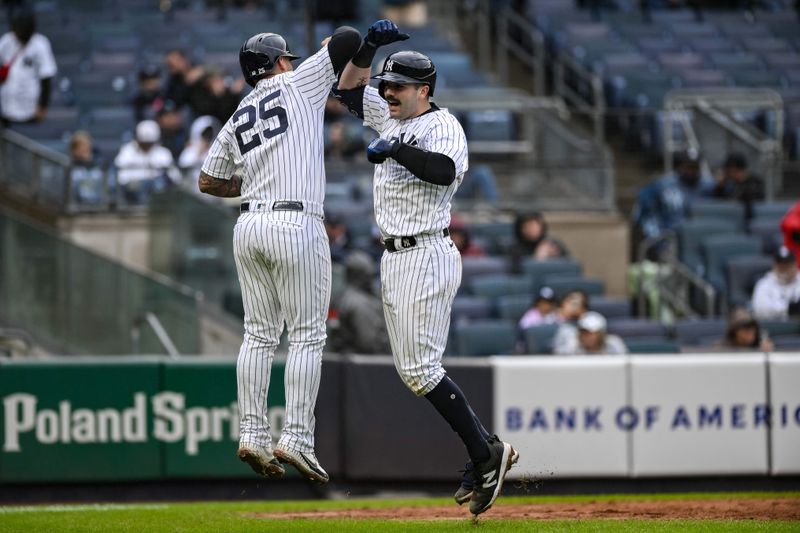 Sep 25, 2023; Bronx, New York, USA; New York Yankees catcher Austin Wells (88) celebrates with second baseman Gleyber Torres (25) after hitting a two run home run against the Arizona Diamondbacks during the fourth inning at Yankee Stadium. Mandatory Credit: John Jones-USA TODAY Sports