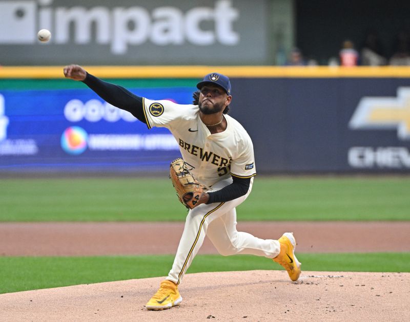 Aug 12, 2024; Milwaukee, Wisconsin, USA; Milwaukee Brewers pitcher Freddy Peralta (51) delivers a pitch against the Los Angeles Dodgers in the first inning at American Family Field. Mandatory Credit: Michael McLoone-USA TODAY Sports