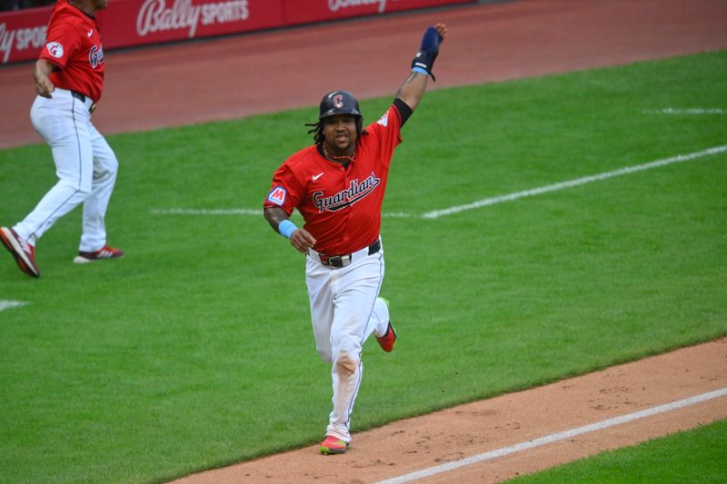 Jun 23, 2024; Cleveland, Ohio, USA; Cleveland Guardians designated hitter Jose Ramirez (11) scores in the third inning against the Toronto Blue Jays at Progressive Field. Mandatory Credit: David Richard-USA TODAY Sports