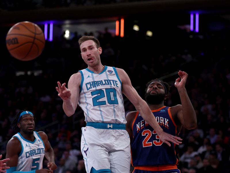 NEW YORK, NEW YORK - NOVEMBER 28:  Gordon Hayward #20 of the Charlotte Hornets passes the ball as Mitchell Robinson #23 of the New York Knicks defends during the second half of an NBA In-Season Tournament game at Madison Square Garden on November 28, 2023 in New York City. The New York Knicks defeated the Charlotte Hornets 115-91.NOTE TO USER: User expressly acknowledges and agrees that, by downloading and or using this photograph, User is consenting to the terms and conditions of the Getty Images License Agreement. (Photo by Elsa/Getty Images)