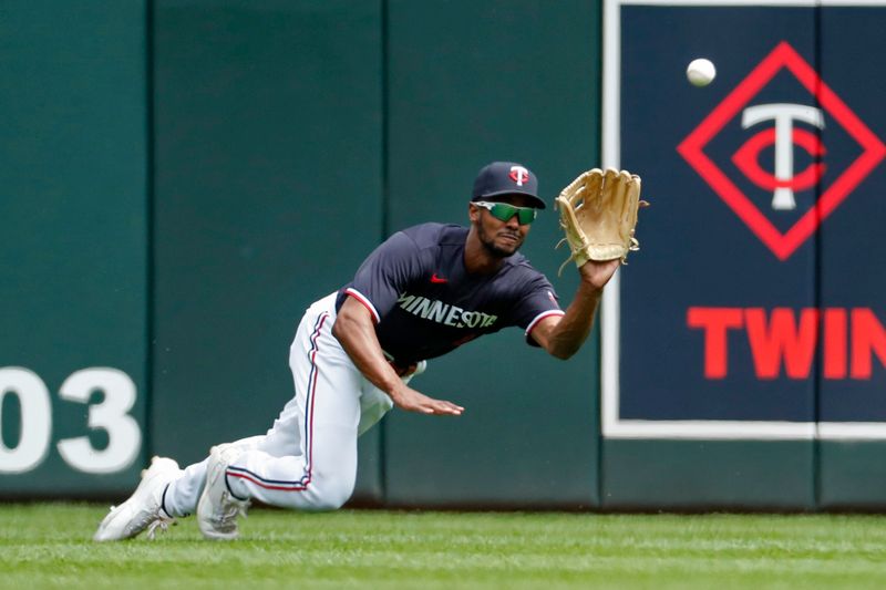 May 11, 2023; Minneapolis, Minnesota, USA; Minnesota Twins center fielder Michael Taylor (2) catches the fly ball of San Diego Padres designated hitter Manny Machado (not pictured) in the eighth inning at Target Field. Mandatory Credit: Bruce Kluckhohn-USA TODAY Sports