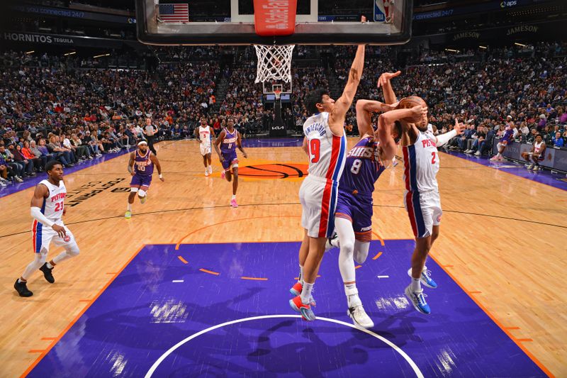 PHOENIX, AZ - FEBRUARY 14:  Cade Cunningham #2 and Simone Fontecchio #19 of the Detroit Pistons plays defense against Grayson Allen #8 of the Phoenix Suns on February 14, 2024 at Footprint Center in Phoenix, Arizona. NOTE TO USER: User expressly acknowledges and agrees that, by downloading and or using this photograph, user is consenting to the terms and conditions of the Getty Images License Agreement. Mandatory Copyright Notice: Copyright 2024 NBAE (Photo by Barry Gossage/NBAE via Getty Images)