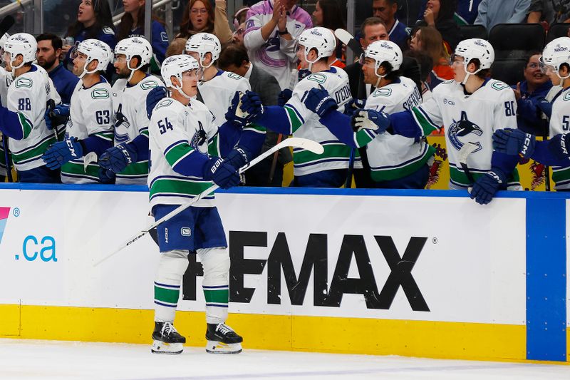 Sep 28, 2025; Edmonton, Alberta, CAN;  The Vancouver Canucks celebrate a goal by forward Aatu Raty (54) during the third period against the Edmonton Oilers at Rogers Place. Mandatory Credit: Perry Nelson-Imagn Images