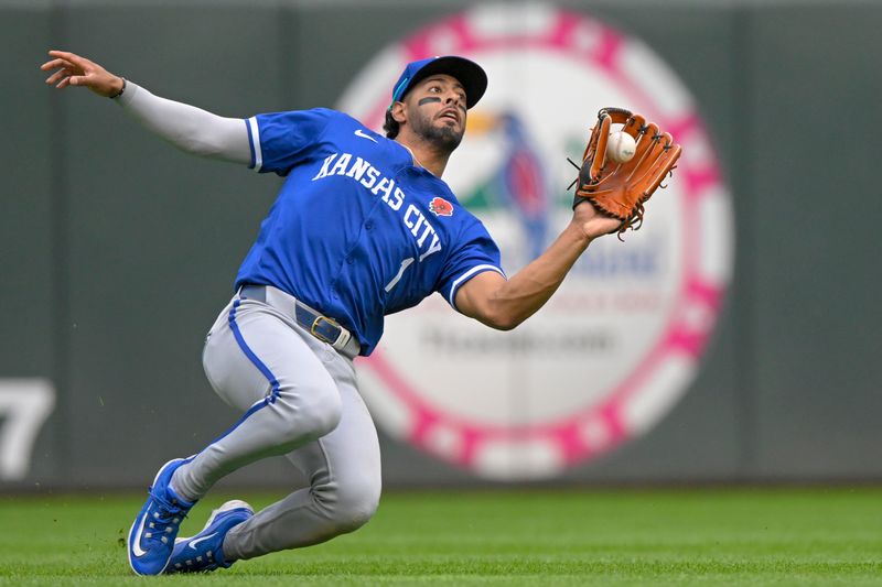 May 27, 2024; Minneapolis, Minnesota, USA; Kansas City Royals outfielder MJ Melendez (1) makes an attempt on a fly ball against the Minnesota Twins during the eighth inning at Target Field. Mandatory Credit: Nick Wosika-USA TODAY Sports