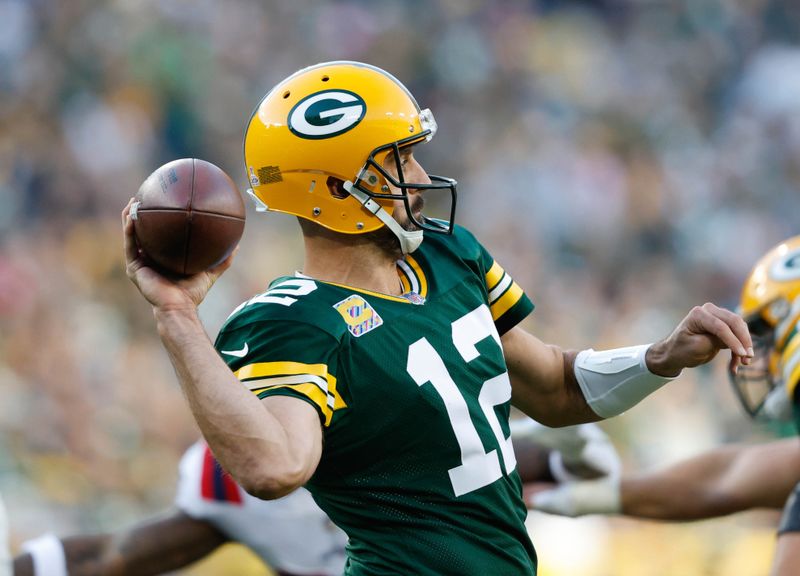 Green Bay Packers quarterback Aaron Rodgers (12) throws off the during an NFL game against the New England Patriots Sunday, Oct. 2, 2022, in Green Bay, Wis. (AP Photo/Jeffrey Phelps)