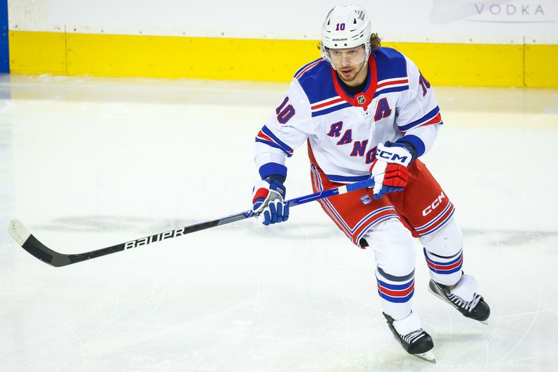 Nov 21, 2024; Calgary, Alberta, CAN; New York Rangers left wing Artemi Panarin (10) skates during the warmup period against the Calgary Flames at Scotiabank Saddledome. Mandatory Credit: Sergei Belski-Imagn Images