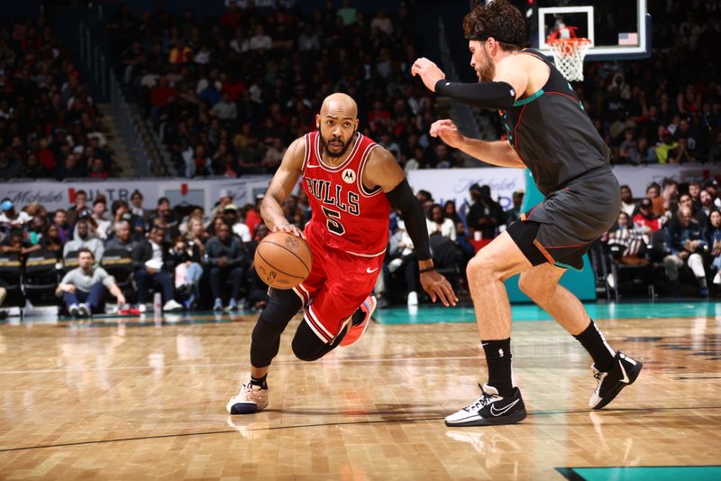 WASHINGTON, DC -? APRIL 12: Jevon Carter #5 of the Chicago Bulls handles the ball during the game against the Washington Wizards on April 12, 2024 at Capital One Arena in Washington, DC. NOTE TO USER: User expressly acknowledges and agrees that, by downloading and or using this Photograph, user is consenting to the terms and conditions of the Getty Images License Agreement. Mandatory Copyright Notice: Copyright 2024 NBAE (Photo by Kenny Giarla/NBAE via Getty Images)