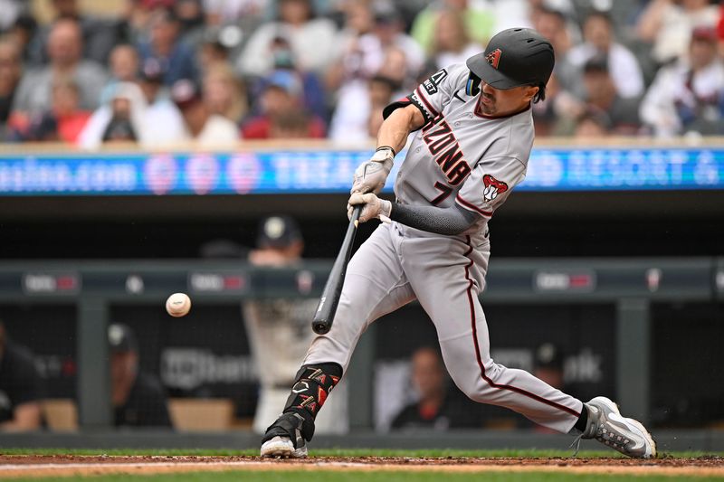 Aug 6, 2023; Minneapolis, Minnesota, USA; Arizona Diamondbacks outfielder Corbin Carroll (7) hits a single against the Minnesota Twins during the third inning at Target Field. Mandatory Credit: Nick Wosika-USA TODAY Sports