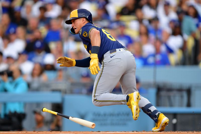 Jul 18, 2025; Los Angeles, California, USA; Milwaukee Brewers outfielder Isaac Collins (6) hits a single in the second inning against the Los Angeles Dodgers at Dodger Stadium. Mandatory Credit: Gary A. Vasquez-Imagn Images