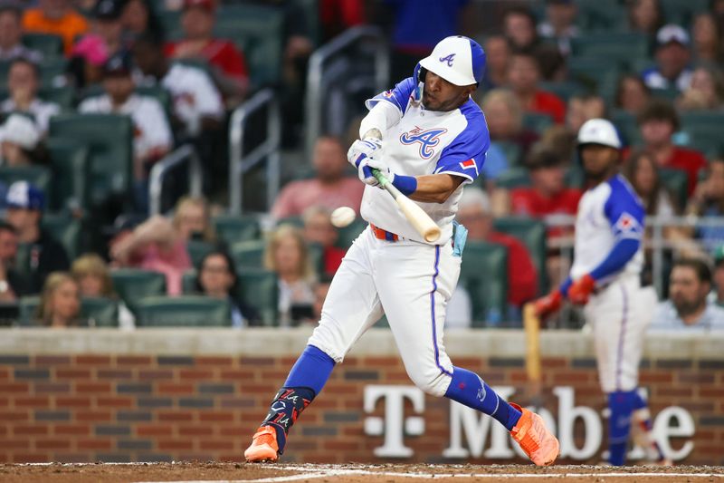 May 6, 2023; Atlanta, Georgia, USA; Atlanta Braves left fielder Eddie Rosario (8) hits a RBI single against the Baltimore Orioles in the fourth inning at Truist Park. Mandatory Credit: Brett Davis-USA TODAY Sports
