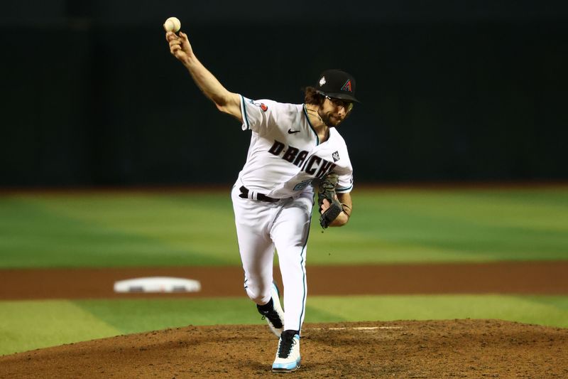 Nov 1, 2023; Phoenix, Arizona, USA; Arizona Diamondbacks starting pitcher Zac Gallen (23) throws a pitch against the Texas Rangers during the sixth inning in game five of the 2023 World Series at Chase Field. Mandatory Credit: Mark J. Rebilas-USA TODAY Sports