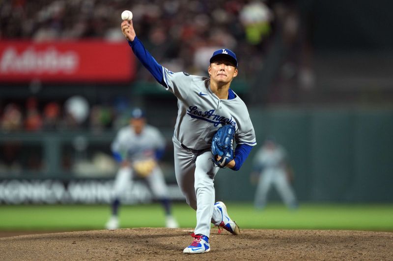 Sep 12, 2025; San Francisco, California, USA; Los Angeles Dodgers starting pitcher Yoshinobu Yamamoto (18) throws a pitch against the San Francisco Giants during the fifth inning at Oracle Park. Mandatory Credit: Darren Yamashita-Imagn Images