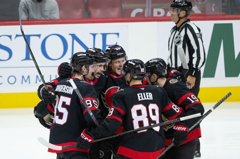 Oct 30, 2025; Ottawa, Ontario, CAN; The Ottawa Senators celebrate a goal scored by defenseman Artem Zub (2) in the third period against the Calgary Flames at the Canadian Tire Centre. Mandatory Credit: Marc DesRosiers-IMAGN Images