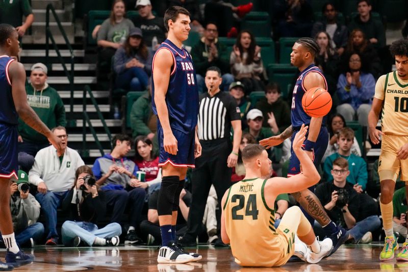 Jan 6, 2024; Charlotte, North Carolina, USA; Florida Atlantic Owls center Vladislav Goldin (50) reacts to his foul on Charlotte 49ers forward Igor Milicic Jr. (24) during the second half at Dale F. Halton Arena. Mandatory Credit: Jim Dedmon-USA TODAY Sports