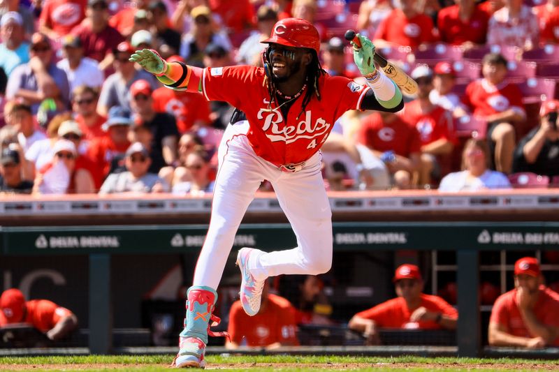 Sep 21, 2024; Cincinnati, Ohio, USA; Cincinnati Reds shortstop Elly De La Cruz (44) dodges a wild pitch in the first inning against the Pittsburgh Pirates at Great American Ball Park. Mandatory Credit: Katie Stratman-Imagn Images