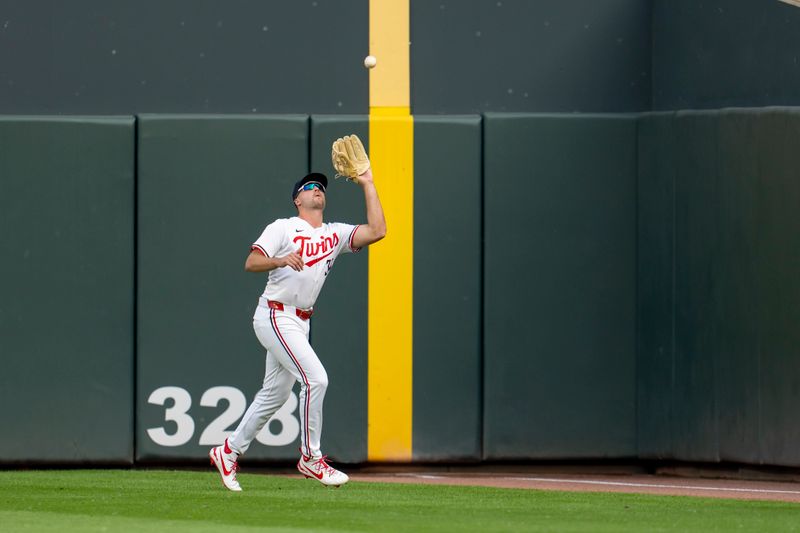 Jun 10, 2025; Minneapolis, Minnesota, USA; Minnesota Twins right fielder Matt Wallner (38) catches a fly ball against the Texas Rangers in the first inning at Target Field. Mandatory Credit: Jesse Johnson-Imagn Images