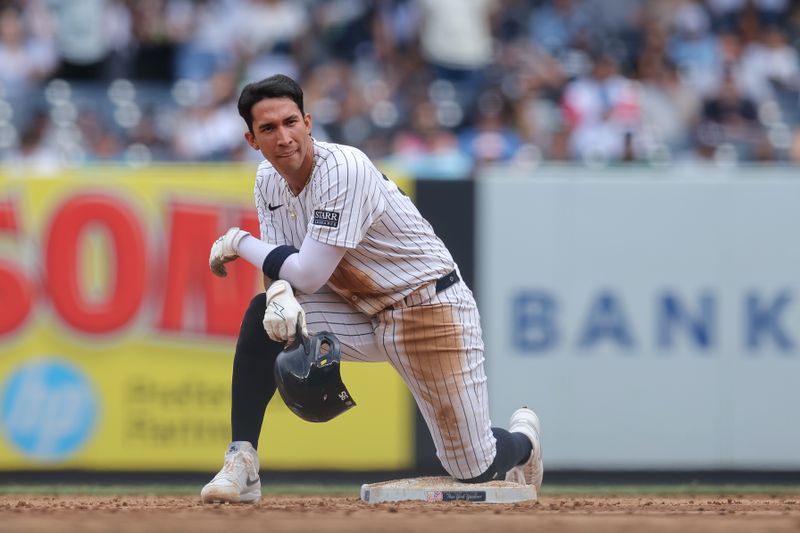 May 23, 2024; Bronx, New York, USA; New York Yankees third baseman Oswaldo Cabrera (95) reacts after being caught attempting to steal second base against the Seattle Mariners during the sixth inning at Yankee Stadium. Mandatory Credit: Brad Penner-USA TODAY Sports