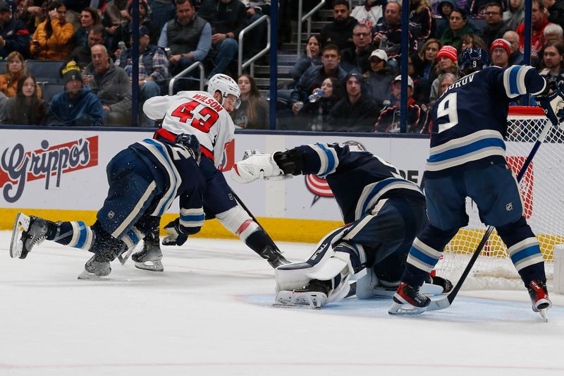 Dec 21, 2023; Columbus, Ohio, USA; Columbus Blue Jackets goalie Elvis Merzlikins (90) makes a save on the shot from Washington Capitals right wing Tom Wilson (43) during the second period at Nationwide Arena. Mandatory Credit: Russell LaBounty-USA TODAY Sports