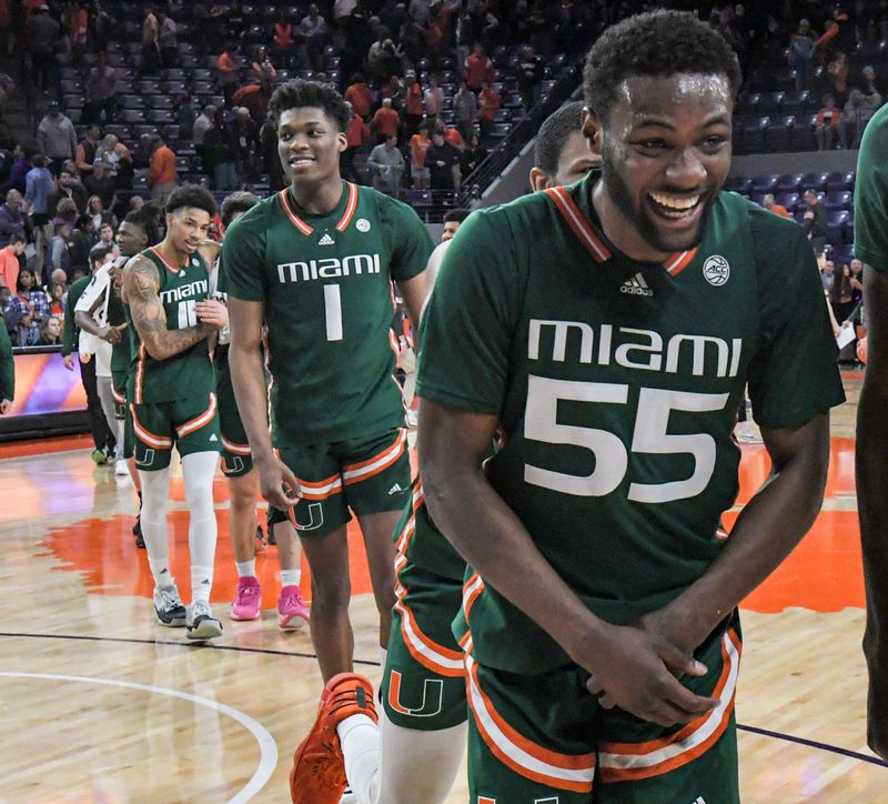 Feb 4, 2023; Clemson, South Carolina, USA; Miami forward Anthony Walker (1) and Miami guard Wooga Poplar (55) celebrate with teammates after the game at Littlejohn Coliseum in Clemson, S.C. Saturday, Feb. 4, 2023. Miami won 78-74.   Mandatory Credit: Ken Ruinard-USA TODAY Sports