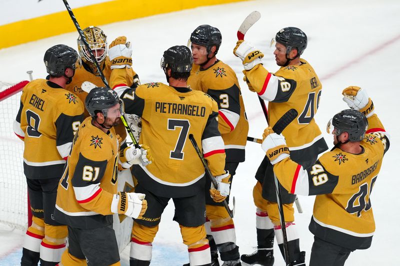 Oct 11, 2024; Las Vegas, Nevada, USA; Vegas Golden Knights players celebrate after defeating the St. Louis Blues 4-3 at T-Mobile Arena. Mandatory Credit: Stephen R. Sylvanie-Imagn Images