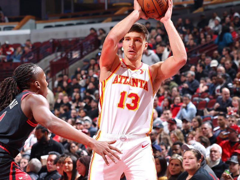 CHICAGO, IL - NOVEMBER 22: Bogdan Bogdanovic #13 of the Atlanta Hawks looks to pass the ball during the game against the Chicago Bulls during the Emirates NBA Cup game on November 22, 2024 at United Center in Chicago, Illinois. NOTE TO USER: User expressly acknowledges and agrees that, by downloading and or using this photograph, User is consenting to the terms and conditions of the Getty Images License Agreement. Mandatory Copyright Notice: Copyright 2024 NBAE (Photo by Jeff Haynes/NBAE via Getty Images)