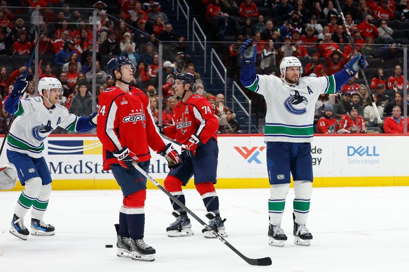 Feb 11, 2024; Washington, District of Columbia, USA; Vancouver Canucks center J.T. Miller (9) celebrates after scoring the game winning goal in overtime against the Washington Capitals at Capital One Arena. Mandatory Credit: Geoff Burke-USA TODAY Sports