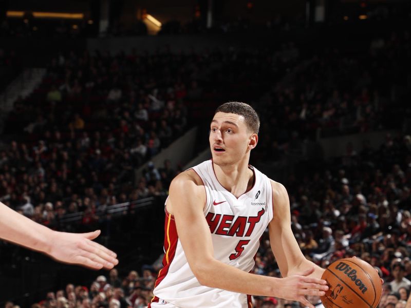 PORTLAND, OR - JANUARY 11:  Nikola Jovic #5 of the Miami Heat handles the ball during the game against the Portland Trail Blazers on January 11, 2025 at the Moda Center Arena in Portland, Oregon. NOTE TO USER: User expressly acknowledges and agrees that, by downloading and or using this photograph, user is consenting to the terms and conditions of the Getty Images License Agreement. Mandatory Copyright Notice: Copyright 2025 NBAE (Photo by Cameron Browne/NBAE via Getty Images)