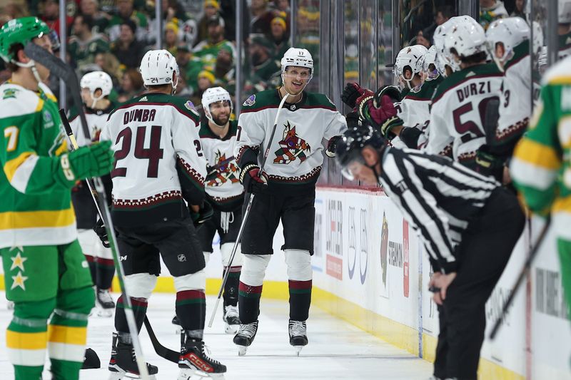 Jan 13, 2024; Saint Paul, Minnesota, USA; Arizona Coyotes center Nick Bjugstad (17) celebrates his hat-trick against the Minnesota Wild during the second period at Xcel Energy Center. Mandatory Credit: Matt Krohn-USA TODAY Sports