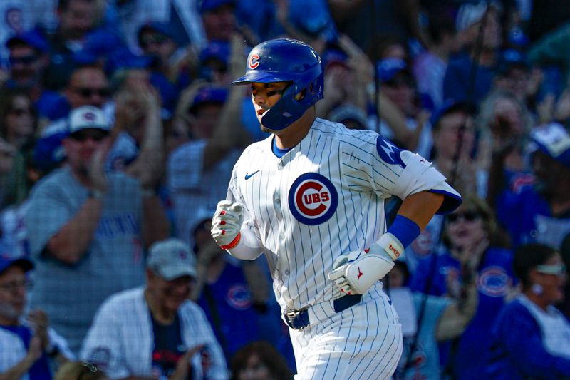 Sep 28, 2025; Chicago, Illinois, USA; Chicago Cubs right fielder Seiya Suzuki (27) rounds the bases after hitting a solo home run against the St. Louis Cardinals during the fifth inning at Wrigley Field. Mandatory Credit: Kamil Krzaczynski-Imagn Images