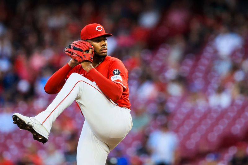 Sep 18, 2025; Cincinnati, Ohio, USA; Cincinnati Reds starting pitcher Hunter Greene (21) pitches against the Chicago Cubs in the first inning at Great American Ball Park. Mandatory Credit: Katie Stratman-Imagn Images