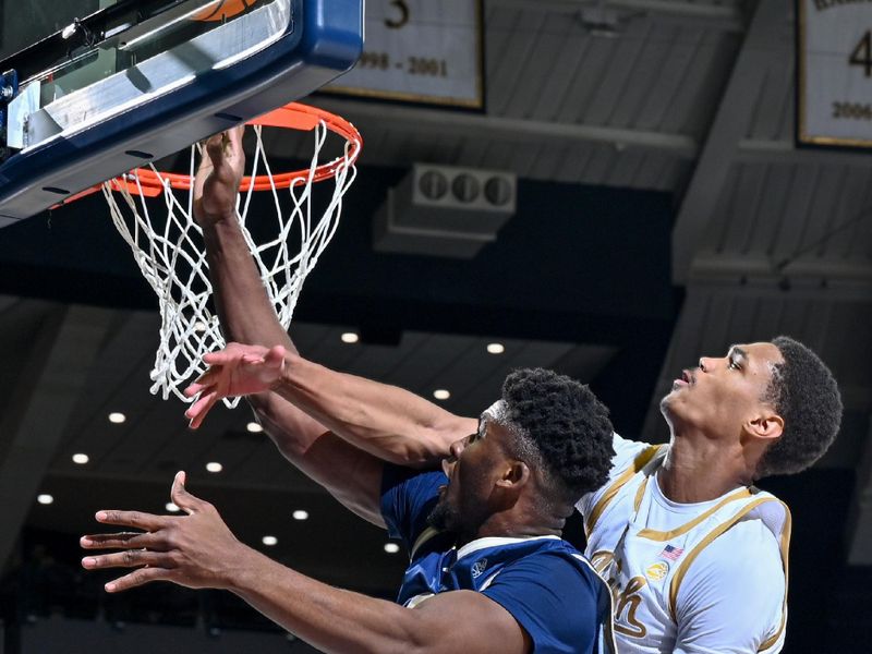 Feb 14, 2024; South Bend, Indiana, USA; Georgia Tech Yellow Jackets forward Ibrahima Sacko (23) goes up for a shot as Notre Dame Fighting Irish forward Tae Davis (13) defends in the first half at the Purcell Pavilion. Mandatory Credit: Matt Cashore-USA TODAY Sports