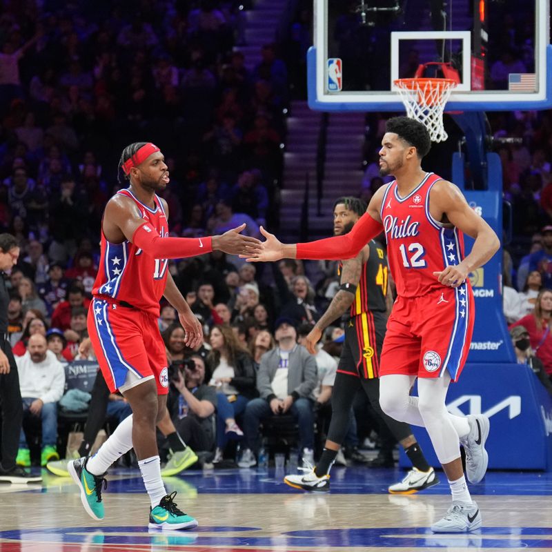 PHILADELPHIA, PA - FEBRUARY 9: Buddy Hield #17 high fives Tobias Harris #12 of the Philadelphia 76ers during the game against the Atlanta Hawks on February 9, 2024 at the Wells Fargo Center in Philadelphia, Pennsylvania NOTE TO USER: User expressly acknowledges and agrees that, by downloading and/or using this Photograph, user is consenting to the terms and conditions of the Getty Images License Agreement. Mandatory Copyright Notice: Copyright 2024 NBAE (Photo by Jesse D. Garrabrant/NBAE via Getty Images)