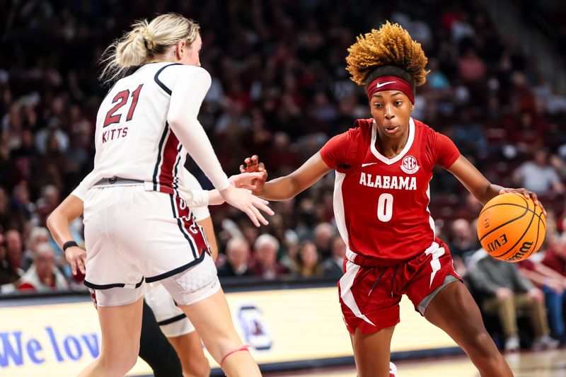 Feb 22, 2024; Columbia, South Carolina, USA; Alabama Crimson Tide guard Loyal McQueen (0) attempts to drives around South Carolina Gamecocks forward Chloe Kitts (21) in the second half at Colonial Life Arena. Mandatory Credit: Jeff Blake-USA TODAY Sports