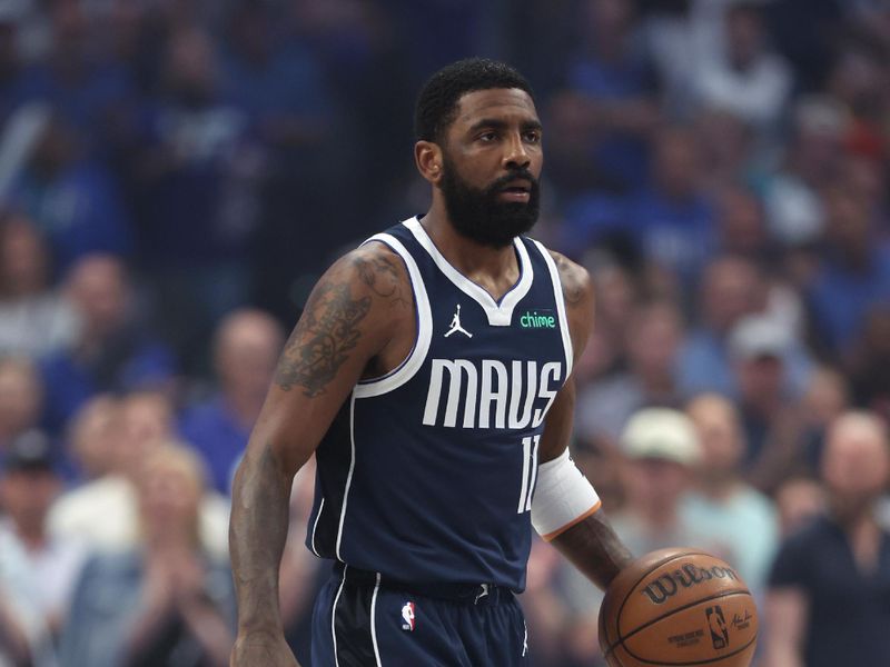 DALLAS, TEXAS - MAY 28:  Kyrie Irving #11 of the Dallas Mavericks handles the ball against the Minnesota Timberwolves during the first half in Game Four of the Western Conference Finals at American Airlines Center on May 28, 2024 in Dallas, Texas. NOTE TO USER: User expressly acknowledges and agrees that, by downloading and or using this photograph, User is consenting to the terms and conditions of the Getty Images License Agreement. (Photo by Matthew Stockman/Getty Images)