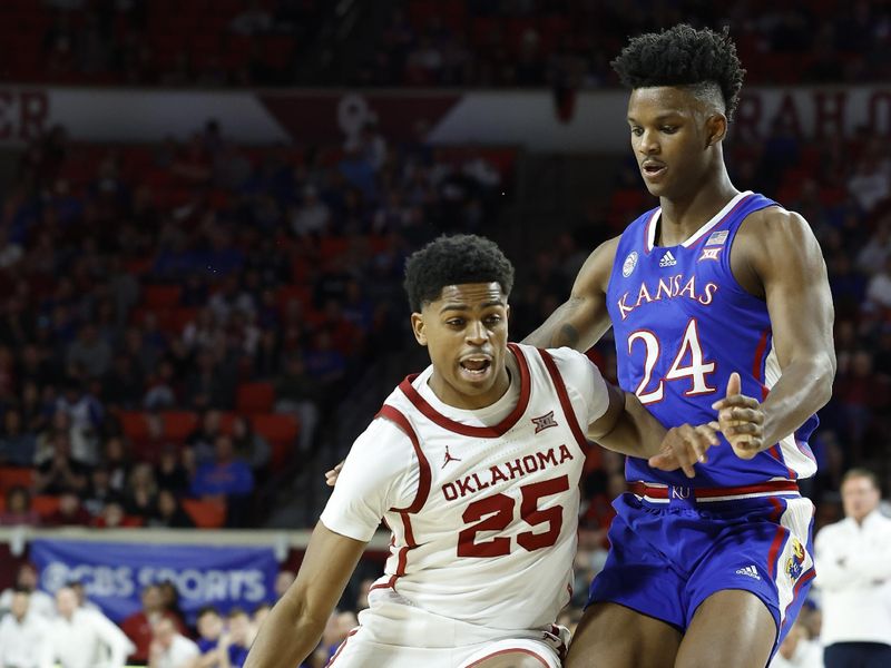 Feb 11, 2023; Norman, Oklahoma, USA; Oklahoma Sooners guard Grant Sherfield (25) drives around Kansas Jayhawks forward K.J. Adams Jr. (24) during the second half at Lloyd Noble Center. Kansas won 78-55. Mandatory Credit: Alonzo Adams-USA TODAY Sports