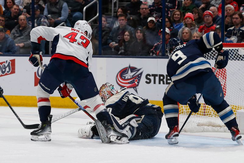 Dec 21, 2023; Columbus, Ohio, USA; Washington Capitals right wing Tom Wilson (43) reaches for the rebound of a Columbus Blue Jackets goalie Elvis Merzlikins (90) save during the second period at Nationwide Arena. Mandatory Credit: Russell LaBounty-USA TODAY Sports