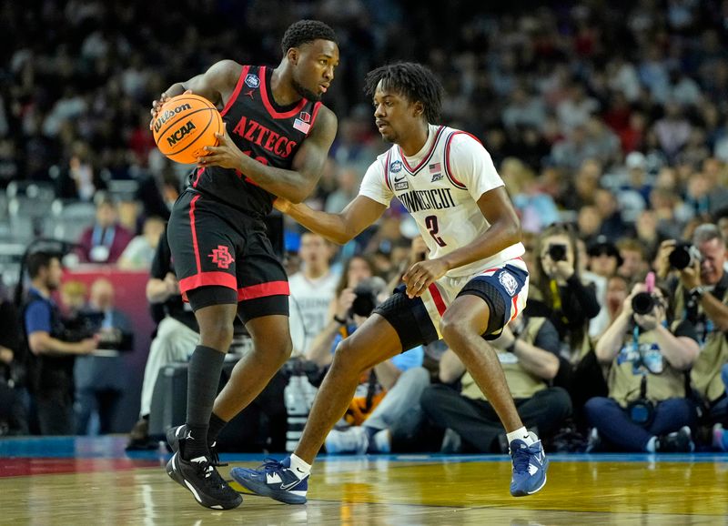 Apr 3, 2023; Houston, TX, USA; San Diego State Aztecs guard Darrion Trammell (12) controls the ball against Connecticut Huskies guard Tristen Newton (2) during the first half in the national championship game of the 2023 NCAA Tournament at NRG Stadium. Mandatory Credit: Bob Donnan-USA TODAY Sports