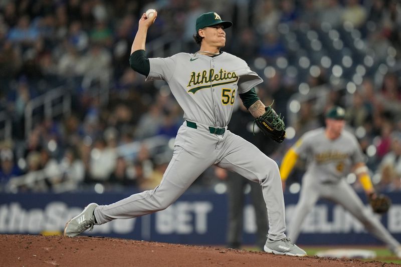 May 29, 2025; Toronto, Ontario, CAN; Athletics pitcher Anthony Maldonado (56) pitches to the Toronto Blue Jays during the second inning at Rogers Centre. Mandatory Credit: John E. Sokolowski-Imagn Images