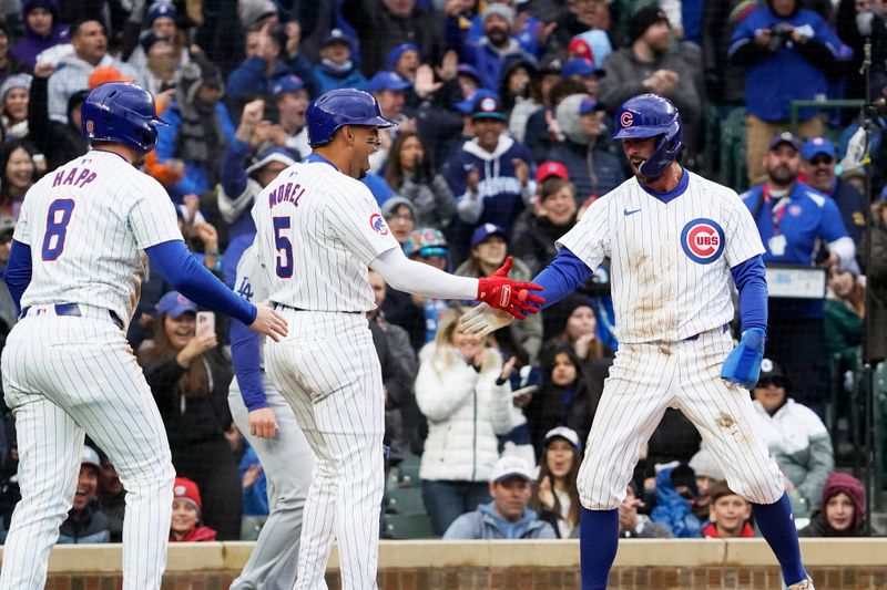 Apr 7, 2024; Chicago, Illinois, USA; Chicago Cubs shortstop Dansby Swanson (7) celebrates with third base Christopher Morel (5) and outfielder Ian Happ (8) after scoring a run against the Los Angeles Dodgers during the first inning at Wrigley Field. Mandatory Credit: David Banks-USA TODAY Sports