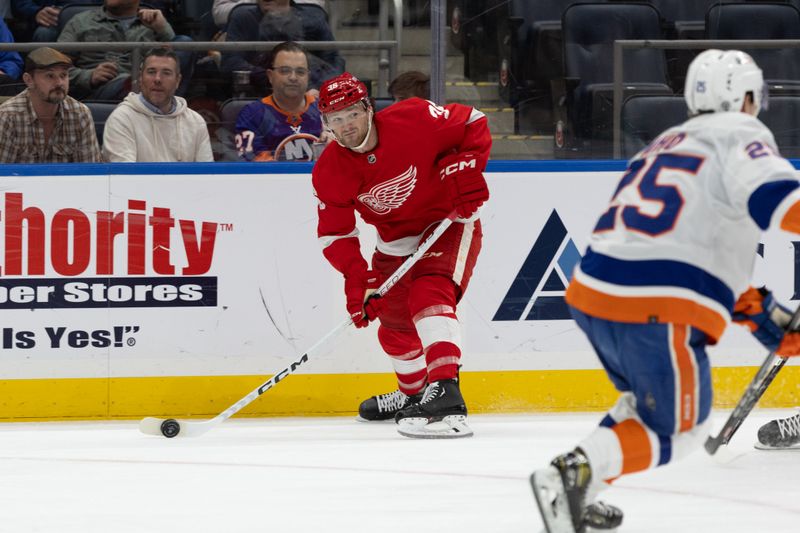 Oct 30, 2023; Elmont, New York, USA; Detroit Red Wings right wing Christian Fischer (36) looks to make a pass against the New York Islanders during the first period at UBS Arena. Mandatory Credit: Thomas Salus-USA TODAY Sports