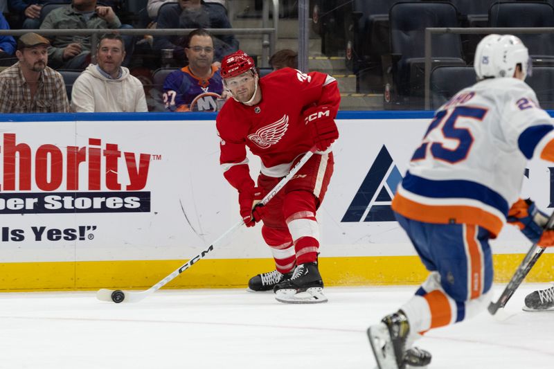 Oct 30, 2023; Elmont, New York, USA; Detroit Red Wings right wing Christian Fischer (36) looks to make a pass against the New York Islanders during the first period at UBS Arena. Mandatory Credit: Thomas Salus-USA TODAY Sports