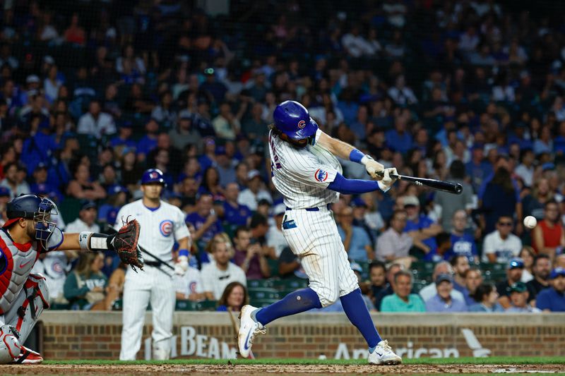 Sep 19, 2024; Chicago, Illinois, USA; Chicago Cubs shortstop Dansby Swanson (7) singles against the Washington Nationals during the first inning at Wrigley Field. Mandatory Credit: Kamil Krzaczynski-Imagn Images