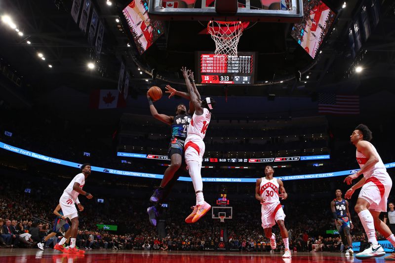 TORONTO, CANADA - MARCH 25: Day'Ron Sharpe #20 of the Brooklyn Nets drives to the basket during the game against the Toronto Raptors on March 25, 2024 at the Scotiabank Arena in Toronto, Ontario, Canada.  NOTE TO USER: User expressly acknowledges and agrees that, by downloading and or using this Photograph, user is consenting to the terms and conditions of the Getty Images License Agreement.  Mandatory Copyright Notice: Copyright 2024 NBAE (Photo by Vaughn Ridley/NBAE via Getty Images)