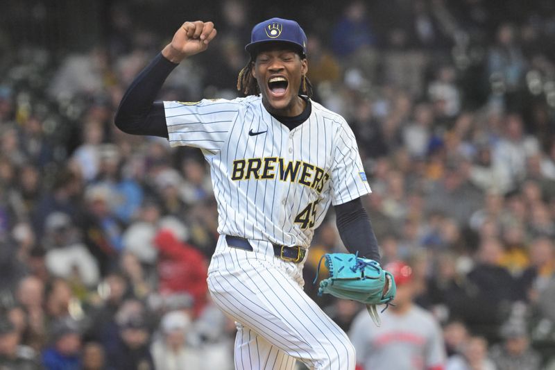 Apr 6, 2025; Milwaukee, Wisconsin, USA;  Milwaukee Brewers pitcher Abner Uribe (45) reacts after retiring the side in the seventh inning against the Cincinnati Reds at American Family Field. Mandatory Credit: Benny Sieu-Imagn Images
