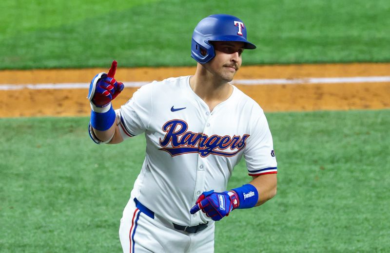 May 14, 2024; Arlington, Texas, USA;  Texas Rangers first base Nathaniel Lowe (30) celebrates after hitting a home run during the fifth inning against the Cleveland Guardians at Globe Life Field. Mandatory Credit: Kevin Jairaj-USA TODAY Sports