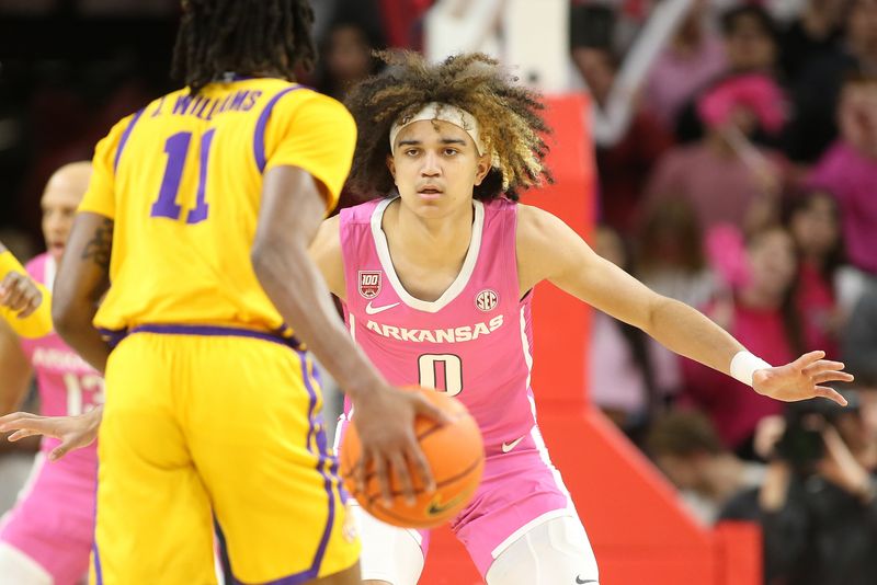 Jan 24, 2023; Fayetteville, Arkansas, USA; Arkansas Razorbacks guard Anthony Black (0) defends against LSU Tigers guard Justice Williams (11) during the first half at Bud Walton Arena. Mandatory Credit: Nelson Chenault-USA TODAY Sports