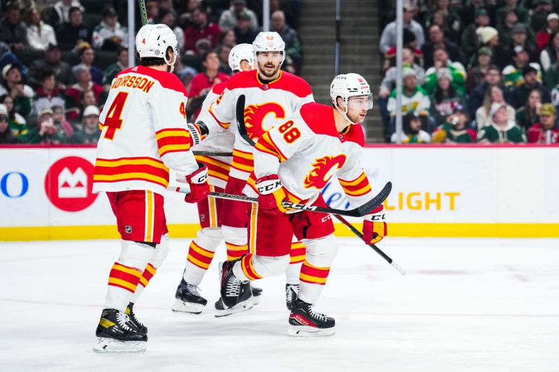 Jan 2, 2024; Saint Paul, Minnesota, USA; Calgary Flames left wing Andrew Mangiapane (88) celebrates his goal with teammates during the first period against the Minnesota Wild at Xcel Energy Center. Mandatory Credit: Brace Hemmelgarn-USA TODAY Sports