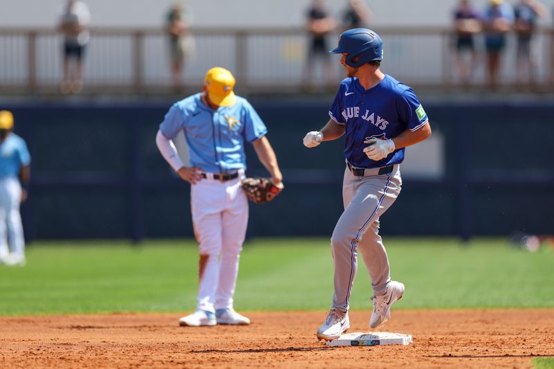 Mar 11, 2024; Port Charlotte, Florida, USA;  Toronto Blue Jays shortstop Ernie Clement (28) runs the bases after hitting a two-run home run against the Tampa Bay Rays in the second inning at Charlotte Sports Park. Mandatory Credit: Nathan Ray Seebeck-USA TODAY Sports